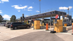 Canadian border checkpoint where vehicles undergo inspection amid rising U.S. duties affecting retailers