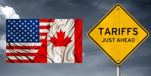 U.S. and Canadian flags beside a warning sign about tariffs, illustrating the impact of U.S. duties on Canadian retailers.